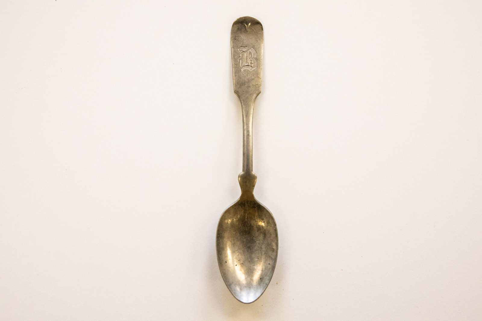 Pictured: A silver spoon monagrammed with the letter ‘B.’ Ella Axelrod has spent months investigating, cataloging and digging into the mysteries of a buried box of odd treasures from the late 1800s and early 1900s as a part of their Summer Collaborative Research.