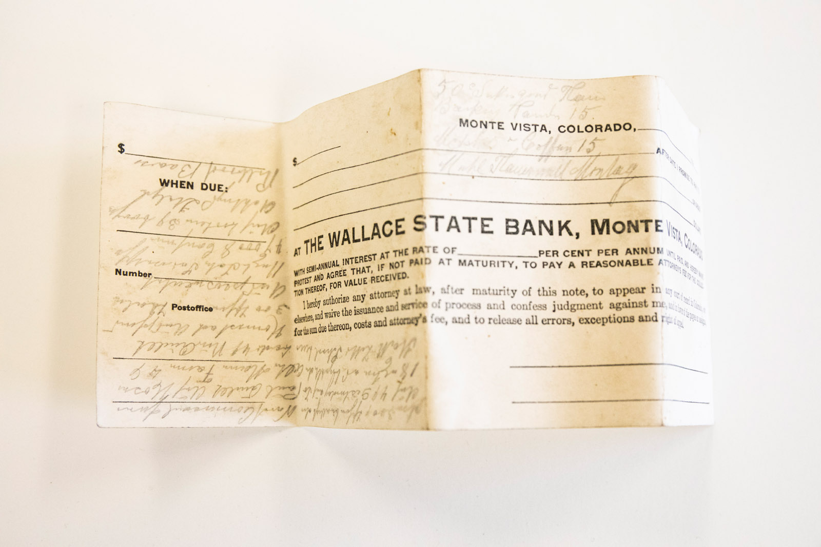 Pictured: A bank statement with writing on it that is may be another language. Ella Axelrod has spent months investigating, cataloging and digging into the mysteries of a buried box of odd treasures from the late 1800s and early 1900s as a part of their Summer Collaborative Research.