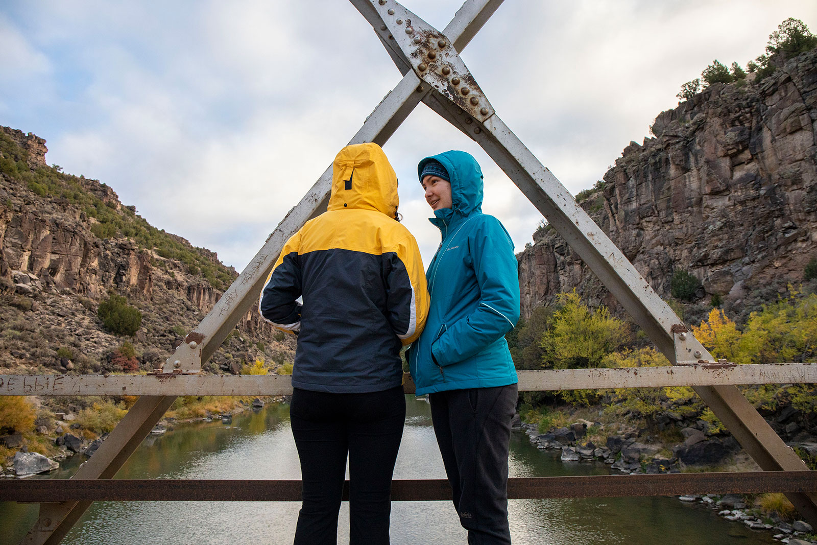 <strong>Lauren Stierman ’22</strong> and <strong>Molly Maier ’22</strong> talk on a bridge over the Rio Grande River before going on a hike.