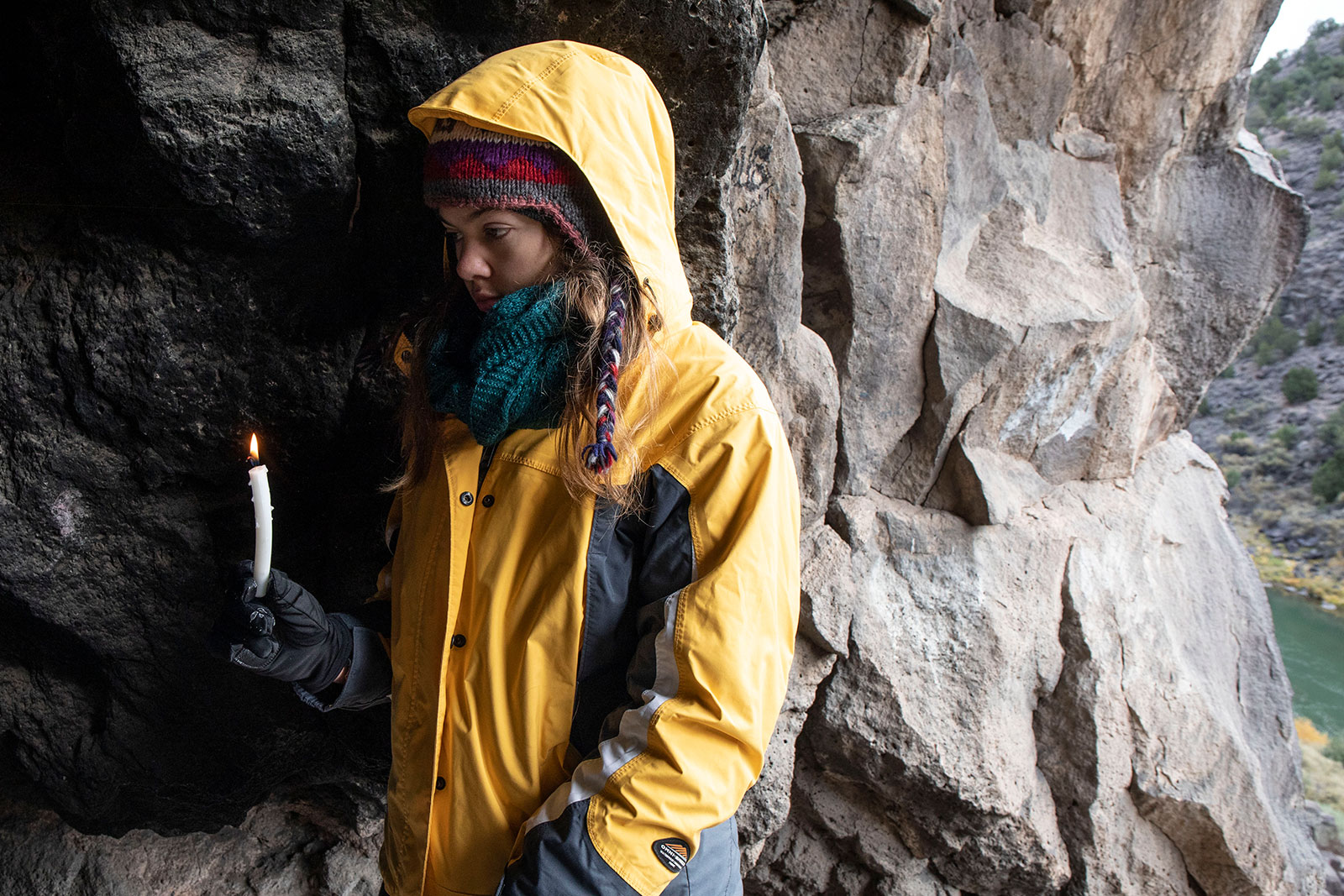 <strong>Lauren Stierman ’22</strong> holds a candle during a ceremony inside of a cave above the Rio Grande River.