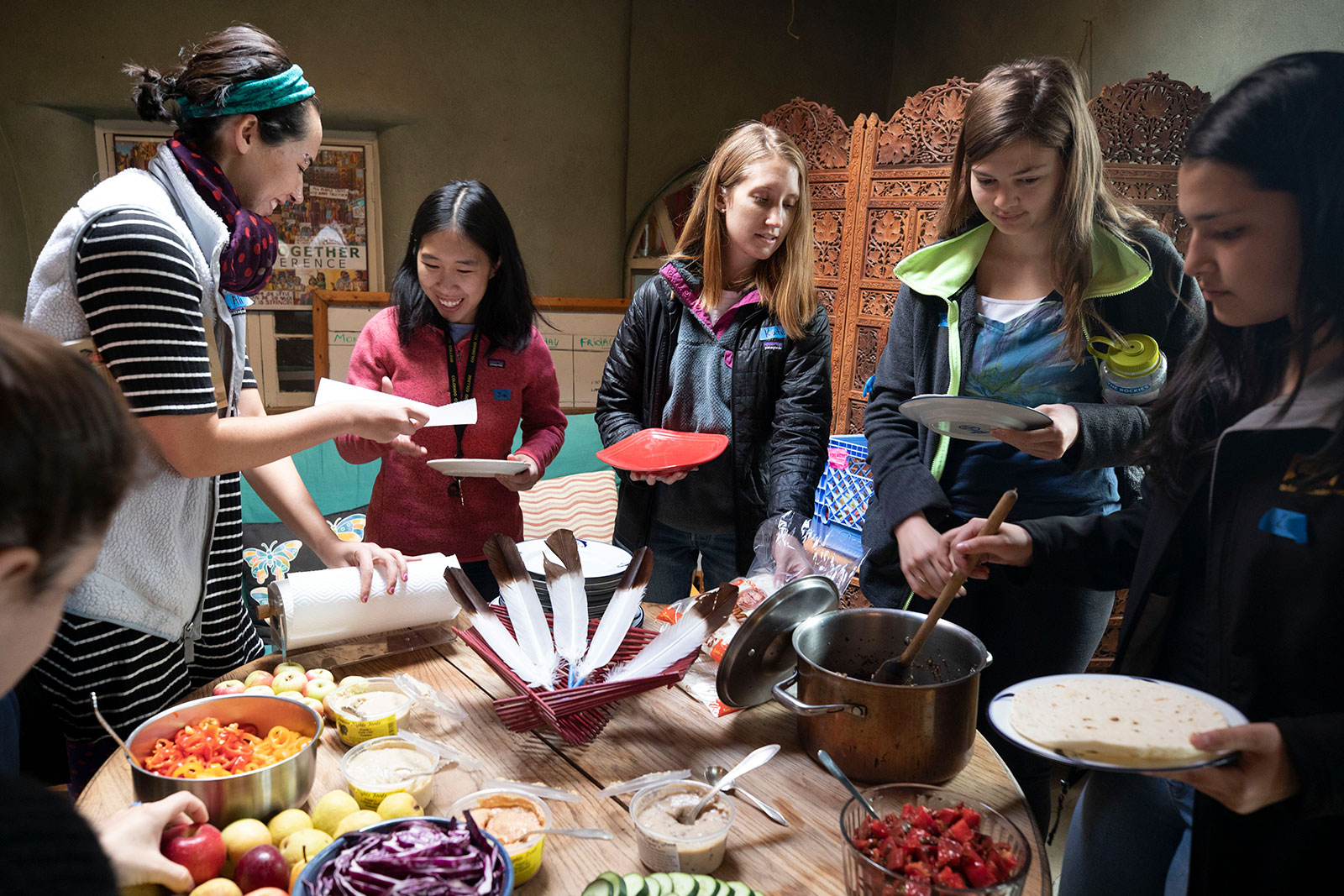 <strong>Ali Baird ’19</strong>, <strong>Jia Mei ’21</strong>, <strong>Kate Schroeder ’20</strong>, and <strong>Lauren Stierman ’22</strong> line up to get some of the locally grown food offered during their meals at TiLT.