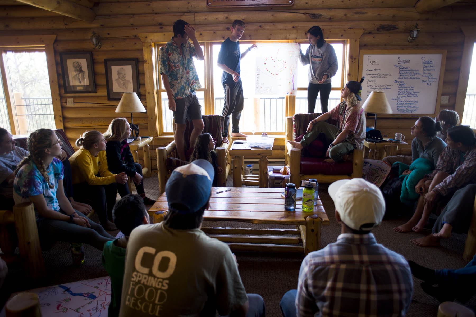 Students take turns explaining their "ideal outdoor education community" drawings during outdoor leadership training on Sunday, October 7, 2018 at the Gilmore Stabler Cabin.