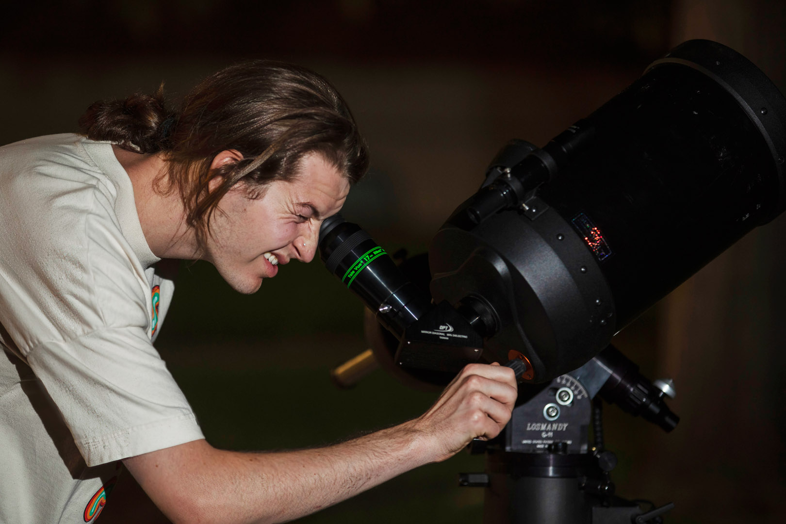 Christian Olsen ’23 looks at the sky through a telescope during a skywatching party in fourth week of his PC133 Astronomy class. Photo taken by Mila Naumovska ’26 on Sept. 19, 2022. 
