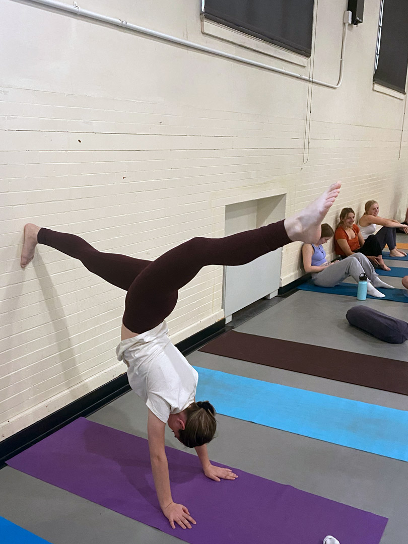 Grace Witulski '25 is pictured doing a handstand as part of an exercise during her Body in Motion Block 2 class on Oct. 14. Photo taken by Alyssa Kopcyznski '26 and submitted by Grace Witulski '25. 