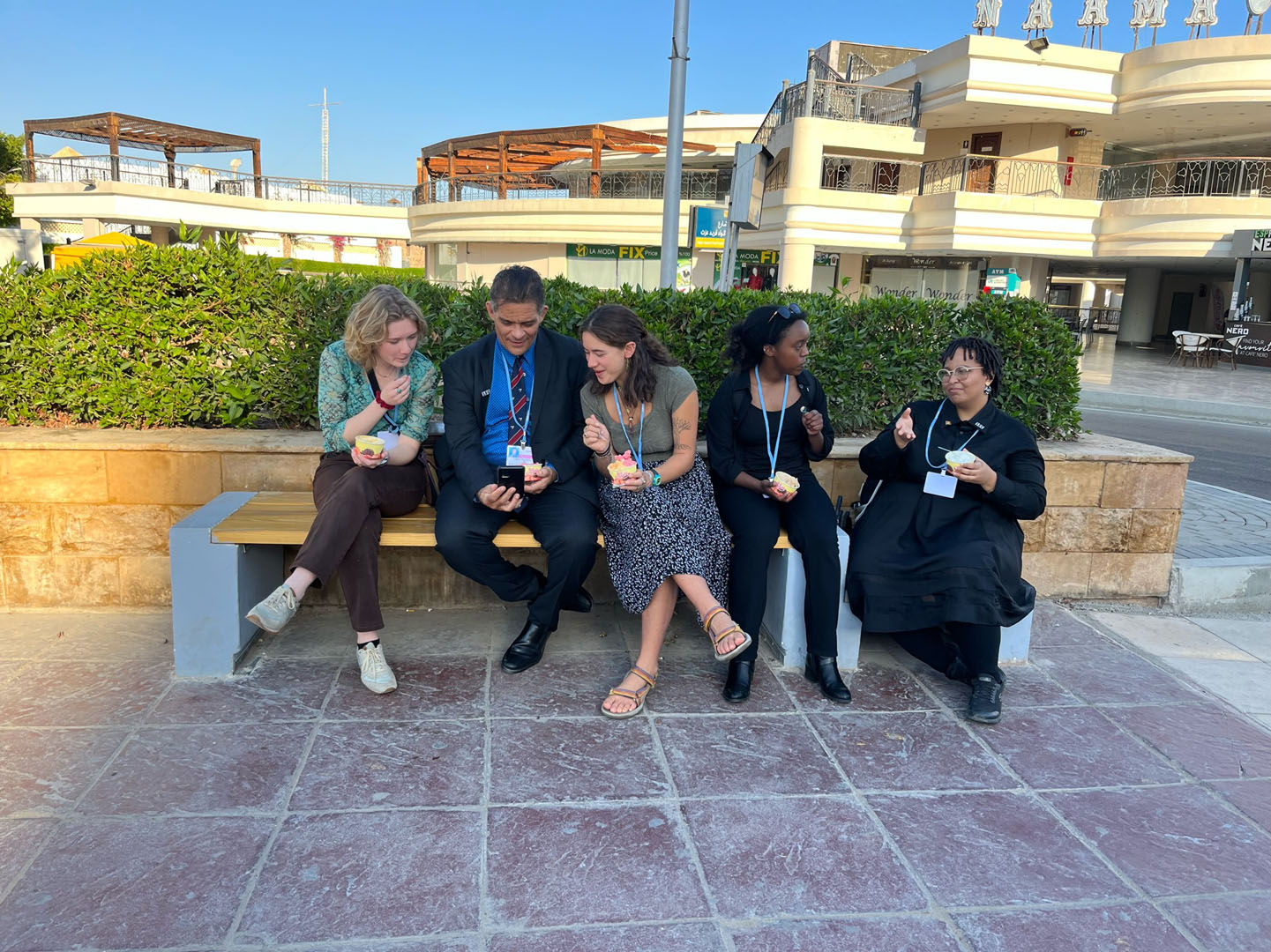 Rhetta Power '23, Johann Hoschtialek (Grenada delegate), Naomi Henry '24, Layla Haji '25, and Jovana Hoschtialek (Grenada delegate) are pictured eating ice cream. Photo submitted by Cecilia Timberg '24. 