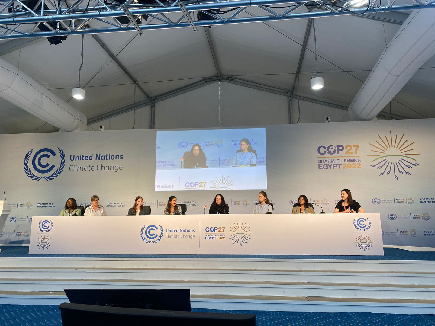 Myra Jackson, Sarah Hautzinger, Gracie Roe '25, Cecilia Timberg '24, Mary Andrews ' 23, and Mika Alexander '23 in a press conference with CSU and Monash University students at COP 27. Photo taken by Reeve Schroeder '24 and submitted by Mika Alexander '23.