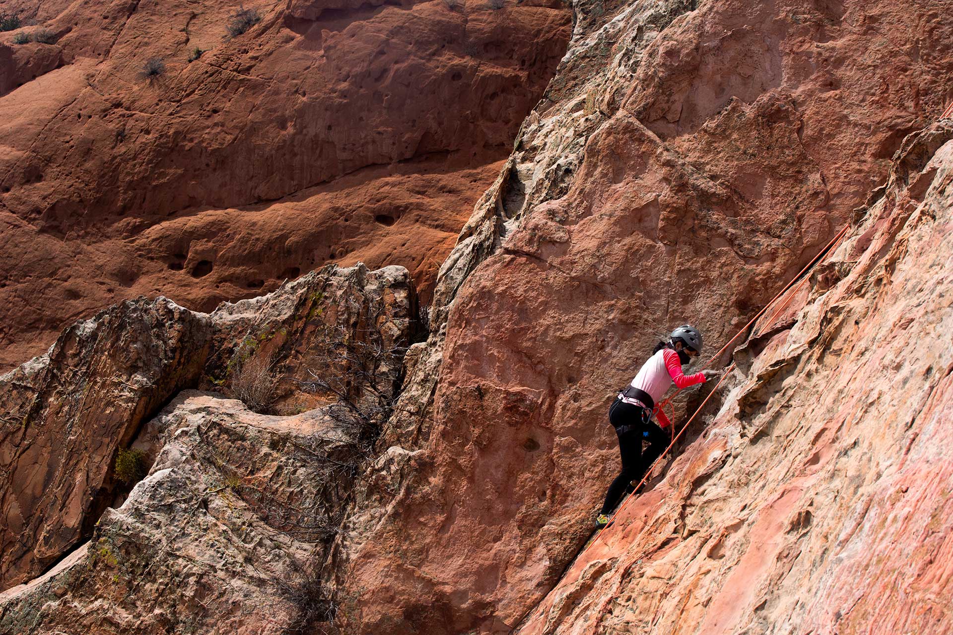 <b>Amanda Martin '23</b> pulls herself up to the next hold while climbing Kindergarten Wall at Garden of the Gods.