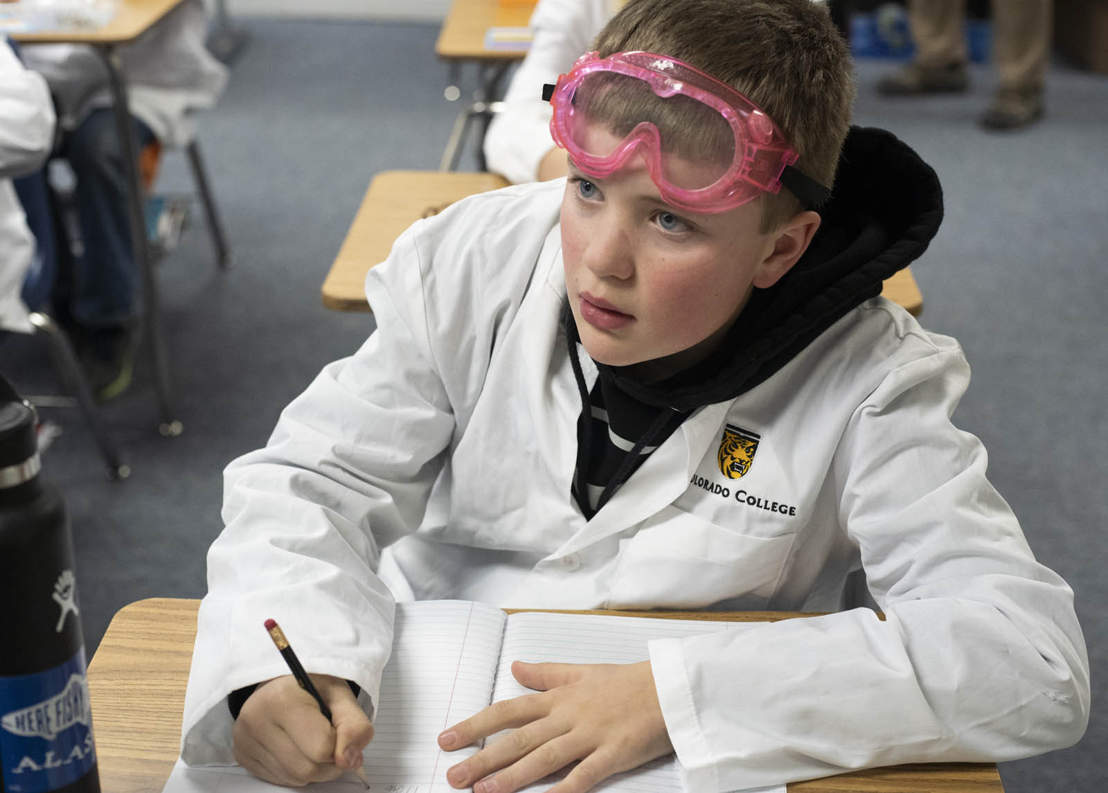Part of the program for La Veta Elementary School students was the exciting opportunity to wear CC lab jackets and goggles during experiments. Photo by Jennifer Coombes.