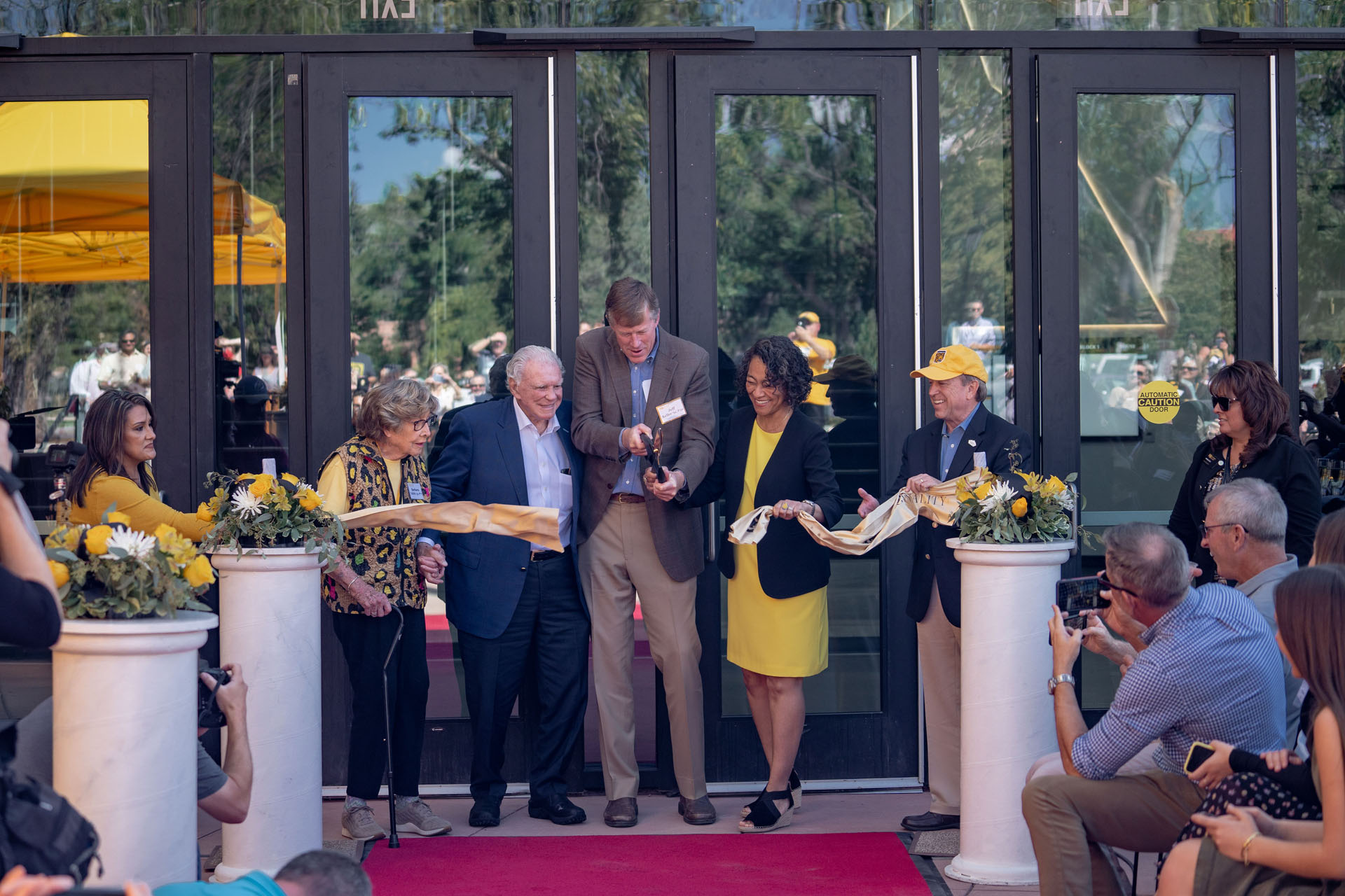 CC celebrated the opening of the new Ed Robson Arena and Yalich Student Services Center with a ribbon-cutting ceremony Saturday, Sept. 18. Left to right: Building namesakes  <strong>Barbara Yalich ’53</strong> and <strong>Ed Robson ’54</strong>, <strong>Jeff Keller ’91 P’22</strong>, chair of CC's Board of Trustees, CC President L. Song Richardson, and Colorado Springs Mayor John Suthers. Photo by Gray Warrior.