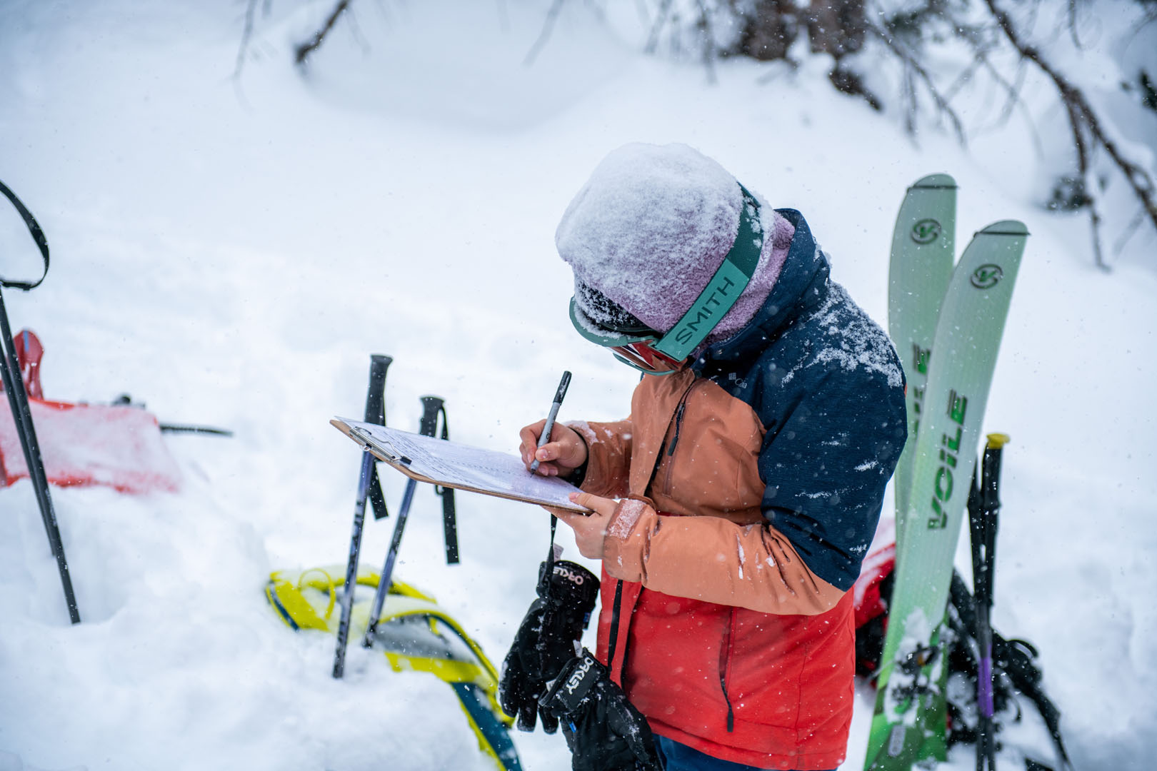 Cathy Xiao ’25 is pictured recording observations from a snow pit. Photo by Matthew Silverman '23. 