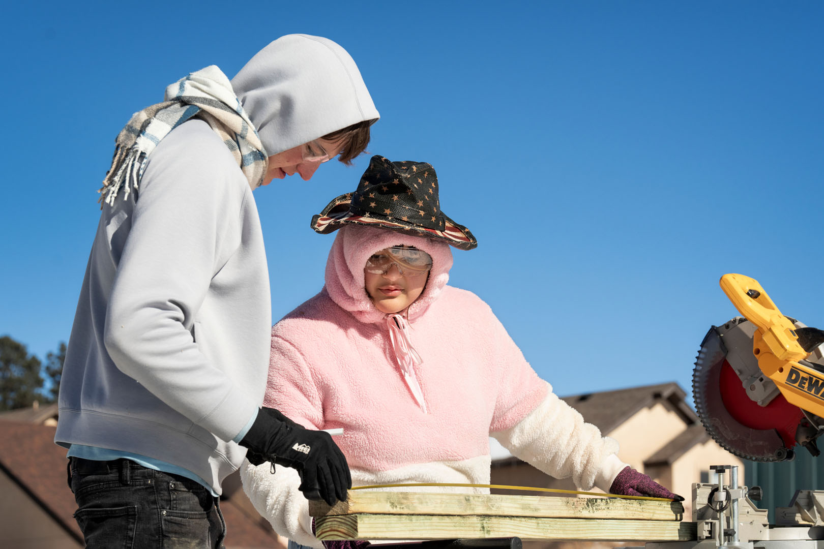 Francis Black '26 and Doré Young ’23 are pictured working at a Habitat for Humanity work site in Woodland Park on Jan. 26, 2023, as part of their WSO Priddy. Photo by Lonnie Timmons III / Colorado College.