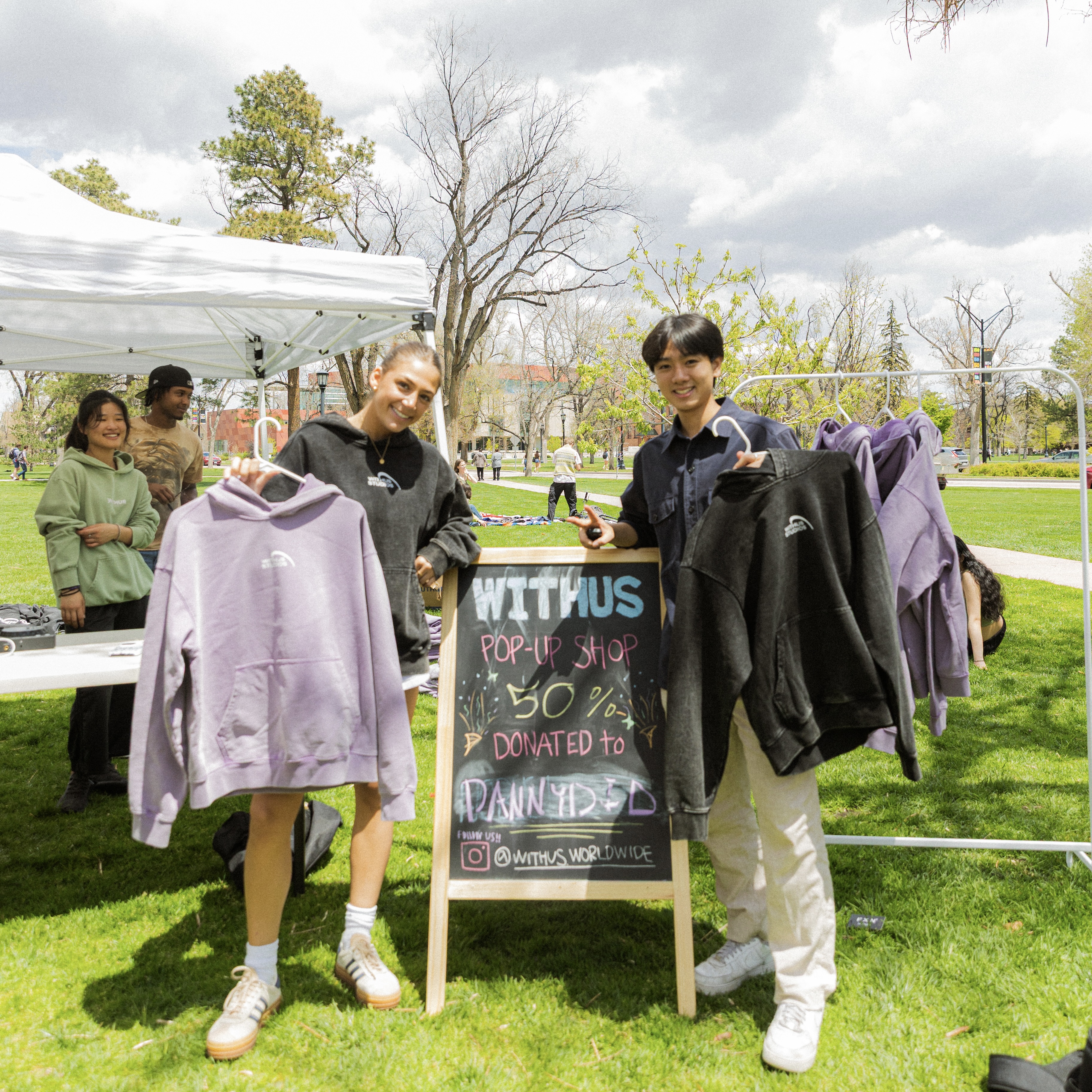 CC students Lydia Vassallo ’27 and Hyungyu Kim '27 at a pop up sale for WITHUS outside Worner Campus Center on May 9, 2025. Photo provided by Kim.