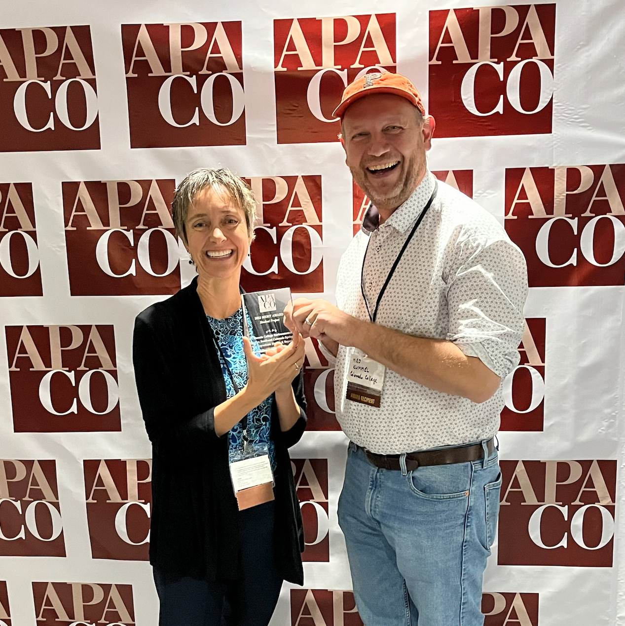 CC professors Dr. Corina McKendry and Dr. Miro Kummel accept a merit award from the Colorado American Planning Association, 9/28/23.