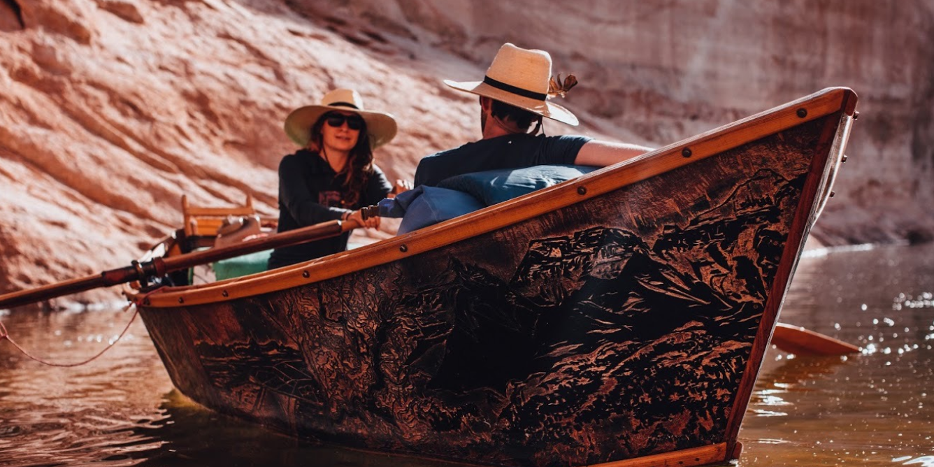Students on the river in a boat they constructed.
