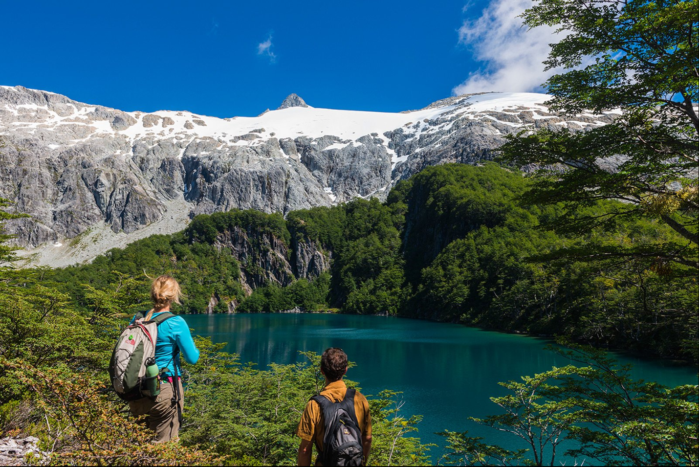 Two hikers overlooking the Futaleufú river.
