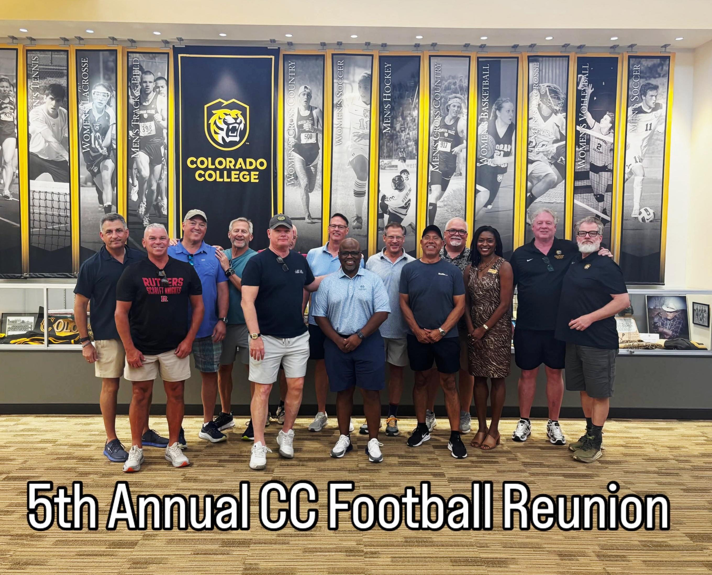 President Manya Whitaker poses with the Colorado College football alumni group