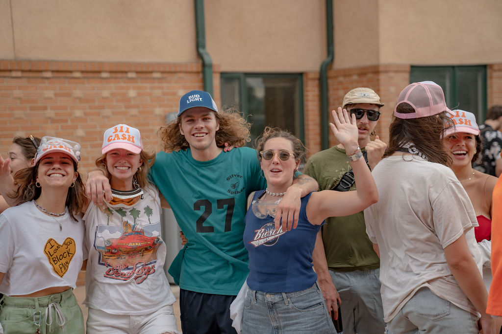 A group of smiling students outside at the senior BBQ <span class="cc-gallery-credit">[Gray Filter Photography]</span>