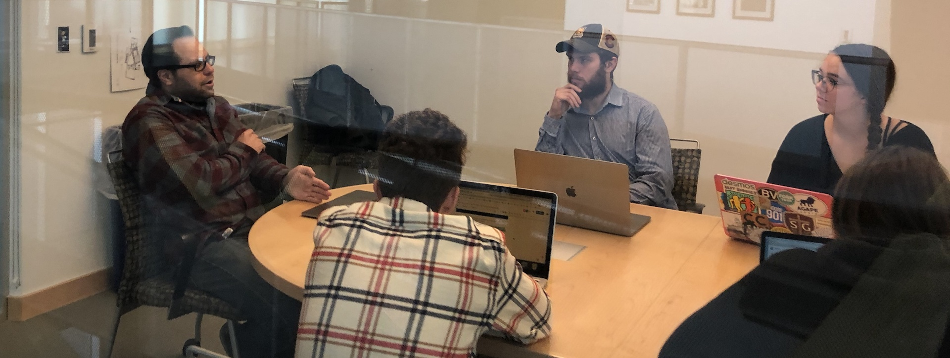 Journalism students strategize with publisher John Rodriguez on a series they produced about cannabis in southern Colorado for PULP newsmagazine in 2019.