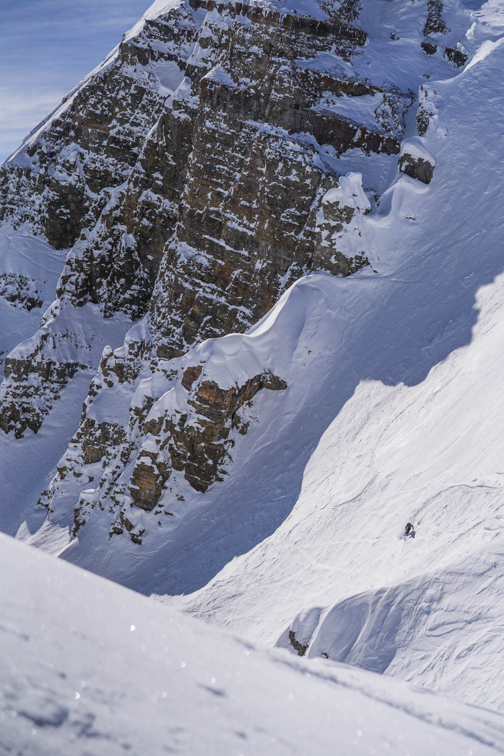 This photo of Patty Owe arcing a turn in the Cody Peak backcountry area was taken in March of 2019 during Spring Break. Cody Peak lies directly adjacent to Grant Teton National Park, and is less than 100 miles from Yellowstone. While it faces the threat of a shorter ski season, this region also faces potentially massive exploitation of oil and gas resources. Opening up our national parks to oil and gas drilling is a tragic move, and puts some of our last wild places at risk of exploitation and degradation on extreme levels. <span class="cc-gallery-credit">[Andrew Hildenbrand • f1.8, 1/800 sec, ISO 80 • Outdoor Recreation]</span>