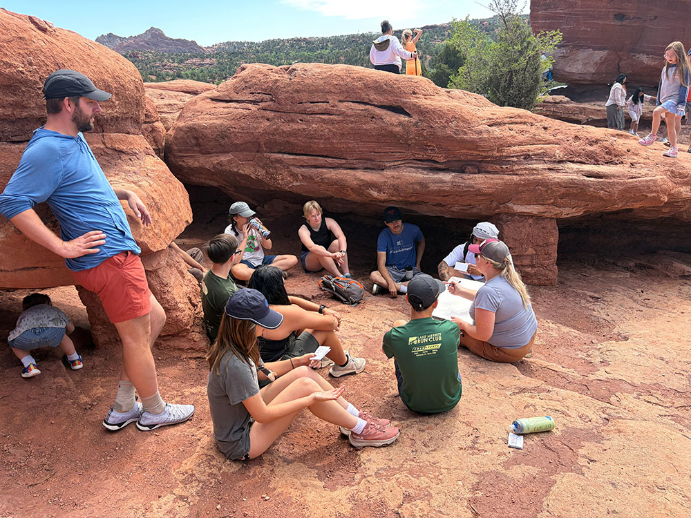 Associate Professor of Geology Michelle Gevedon and Assistant Professor of Mathematics & Computer Science Ben Nye with MCURE students at Garden of the Gods in July 2026.