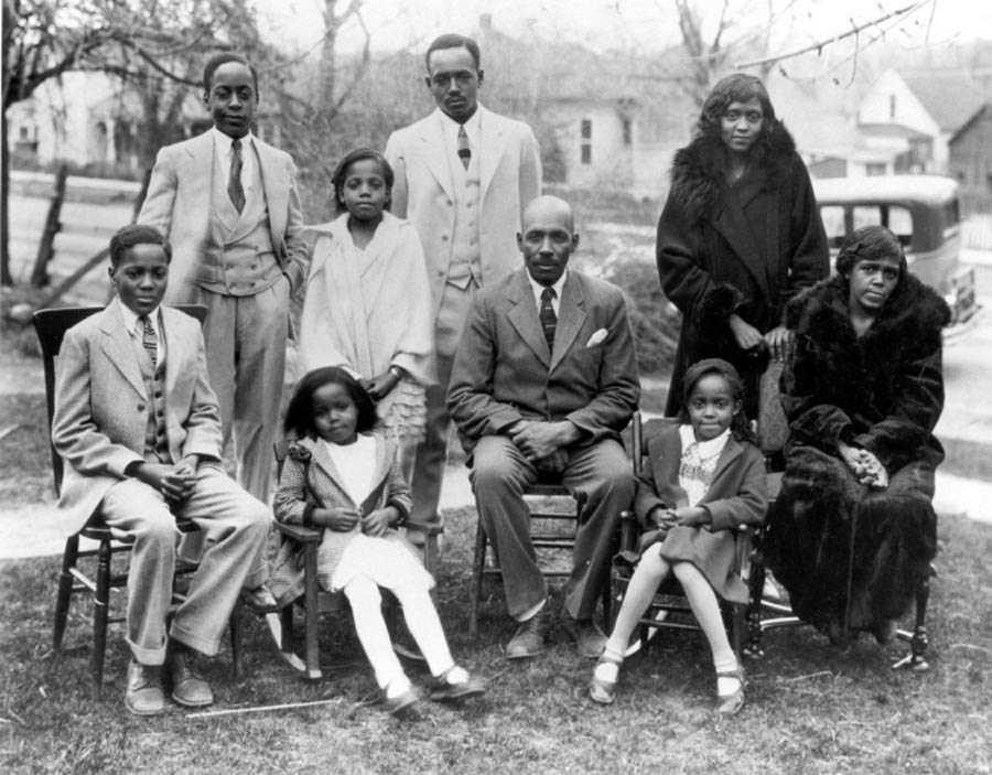 The Rev. KD Stroud and Mrs. Lulu Magee Stroud Family of Colorado Springs, ca 1920-1930. Stroud stands in the center and his sister Effie, who also graduated from Colorado College in 1931, stands at the far right.  <span class="cc-gallery-credit"></span>