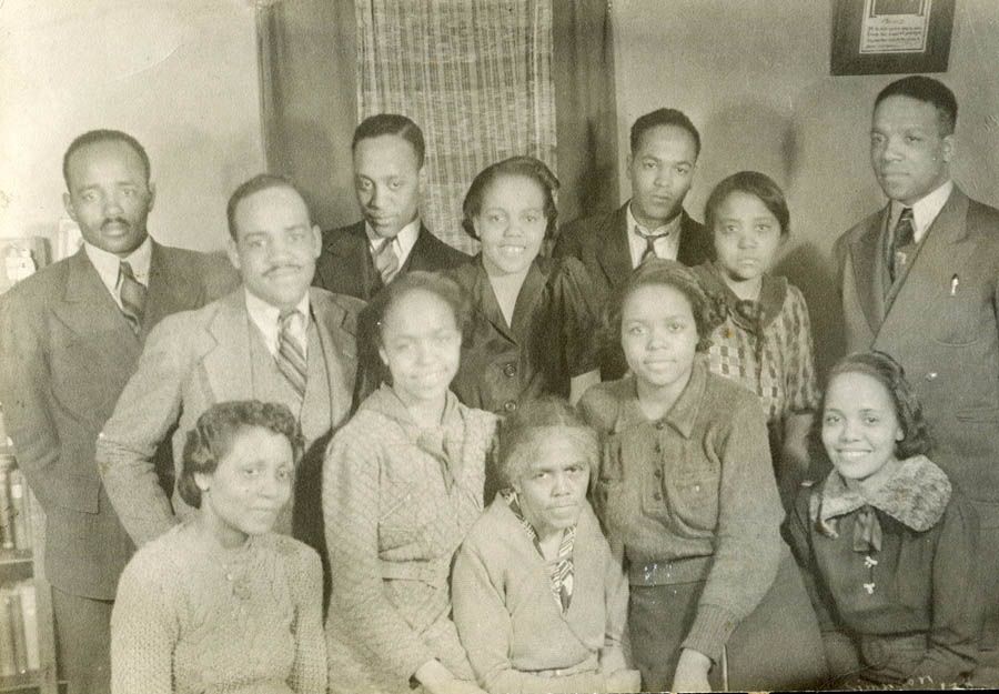 The matriarch of the Stroud family Lulu Magee and her 11 children, taken in 1938 after the death of her husband Rev. Kimbal Dolphus: (back row) Kelley Dolphus, Jack, James, and Albert; (middle row) Tandy, Nina, and Kimball; (front row) Effie, Rosa, Lulu Magee, Bobby, and Lu Lu. The Stroud family has deep American roots: Lulu Magee and her sister were members of the Mvskoke (Creek) tribe and grew up in the eastern United States. They were victims of the U.S. government’s campaign of displacing Indigenous Peoples and forcing them westward, historically known as the “Trail of Tears.” <span class="cc-gallery-credit"></span>