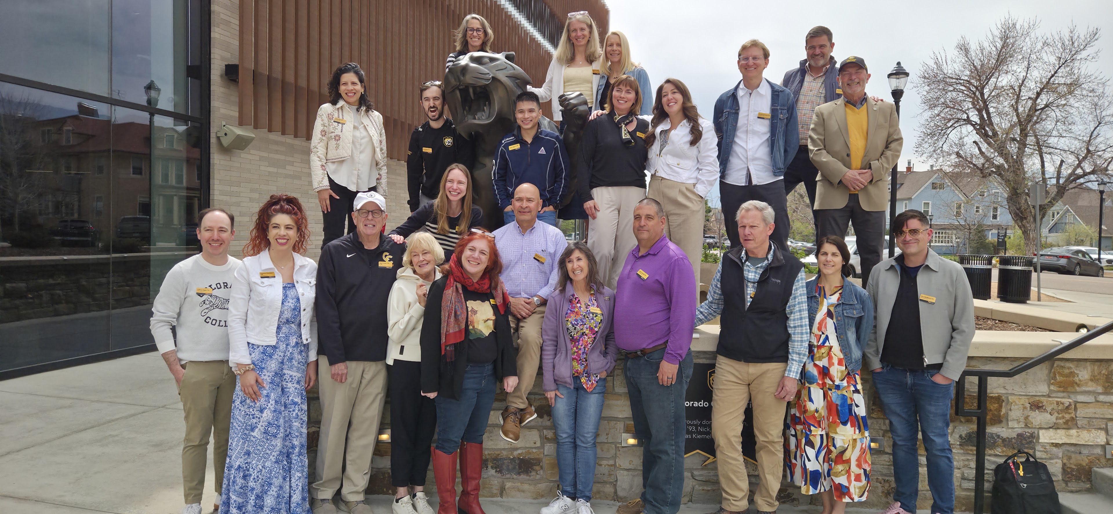 A group photo of AAC standing in front of the Ed Robson Arena