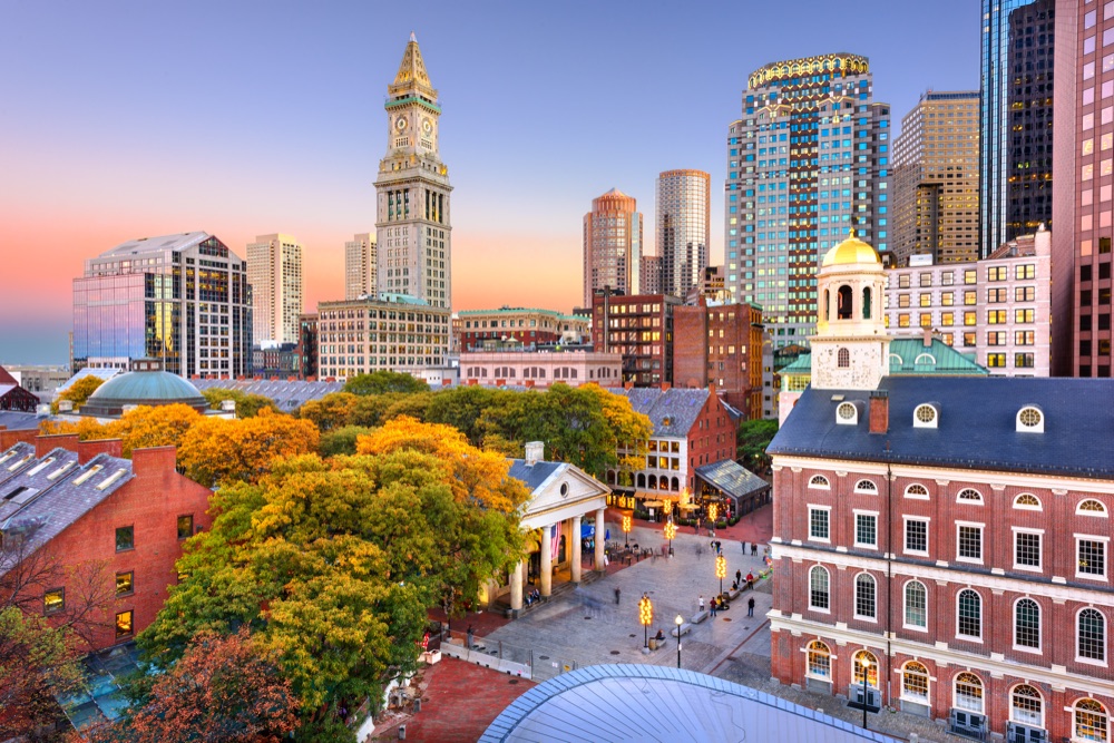 Faneuil Hall and the Boston skyline at sunset.
